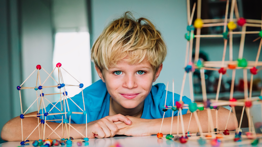 boy playing with sticks